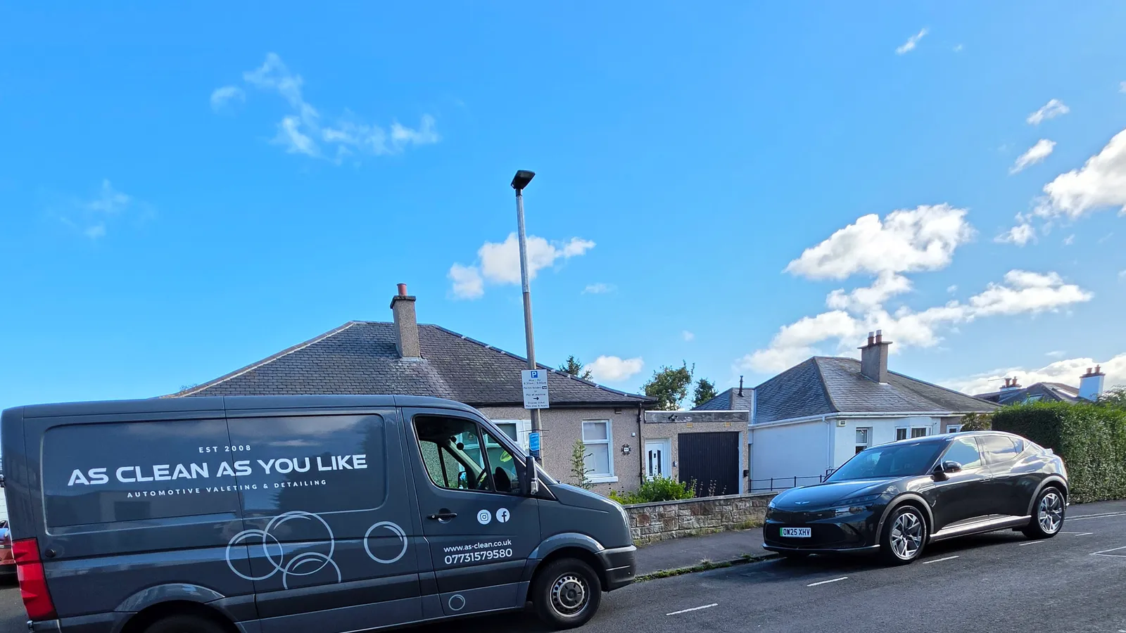 AS-CLEAN branded van parked behind a newly valeted Genesis SUV on a residential street in Craigleith, Edinburgh