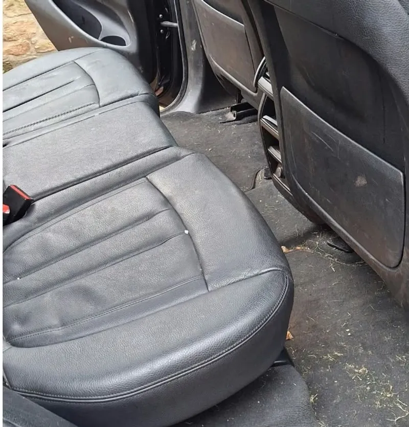Freshly cleaned black leather rear seats in a Mercedes SUV, Leith mobile valet